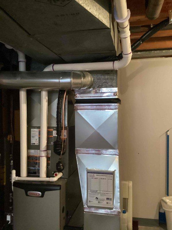 Completed installation of a complete Lennox HVAC system, including a 70,000 BTU furnace and 2-ton air conditioning unit with right-side configuration. System was properly connected to existing ductwork with new PVC venting installed according to code requirements, and all necessary permits were obtained prior to installation.