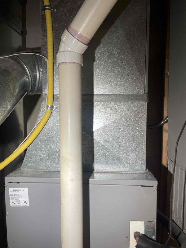 Conducted thorough evaluation of 20-year-old Arcoaire HVAC system for potential replacement. Assessment included inspection of furnace with visible gas line connection, PVC venting, and associated ductwork. Documented current system configuration and recommended full replacement of both furnace and AC components due to age and condition.