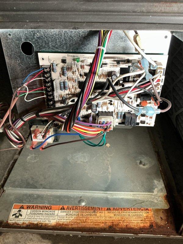 Successfully replaced faulty circuit board (S1-33102977000) in HVAC system as scheduled repair. Verified proper installation with multiple wire harness connections (red, yellow, green, white, blue, black) to control module. System restored to full operational status with new board confirmed through DSG supply.