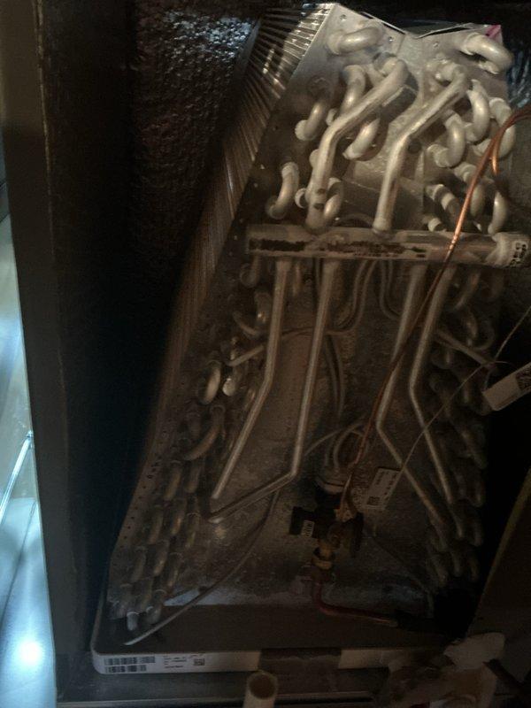 Performed ComfortGuard Maintenance Package on HVAC system, which included thorough inspection of both evaporator coil and heat exchanger components. Documented significant dust and debris accumulation on evaporator coils affecting system efficiency; cleaned coils to restore proper heat transfer and airflow. Inspected heat exchanger assembly for signs of wear and verified integrity of copper lines and electrical connections throughout the system.