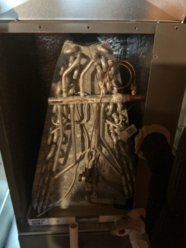 Performed ComfortGuard Maintenance Package on HVAC system, which included thorough inspection of both evaporator coil and heat exchanger components. Documented significant dust and debris accumulation on evaporator coils affecting system efficiency; cleaned coils to restore proper heat transfer and airflow. Inspected heat exchanger assembly for signs of wear and verified integrity of copper lines and electrical connections throughout the system.