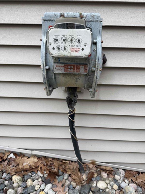 Conducted site assessment for potential installation of a 50-amp generator inlet with panel interlock system to accommodate customer's two Champion 4500-W inverter generators operated in parallel. Also evaluated existing ceiling light location for fan installation with existing wiring. Documented electrical panel condition and exterior mounting options for HOA approval documentation, noting current meter configuration and available space for generator inlet placement.