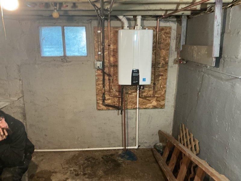 Completed installation of a complete HVAC system including a 70,000 BTU furnace, 2.5-ton air conditioning unit, and tankless water heater. System was properly leveled with pea gravel where needed, with all components reconnected and tested for optimal performance.