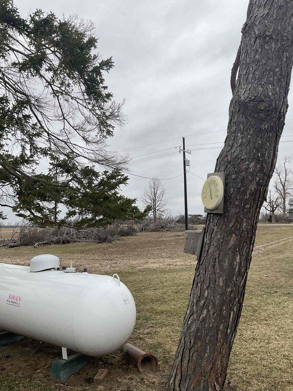 Conducted site assessment for generator installation quote at rural property with existing propane tank. Inspected current HVAC system (Carrier furnace) to evaluate integration requirements for backup power solution. Photos documented exterior utility placement and interior mechanical room configuration for comprehensive estimate preparation.