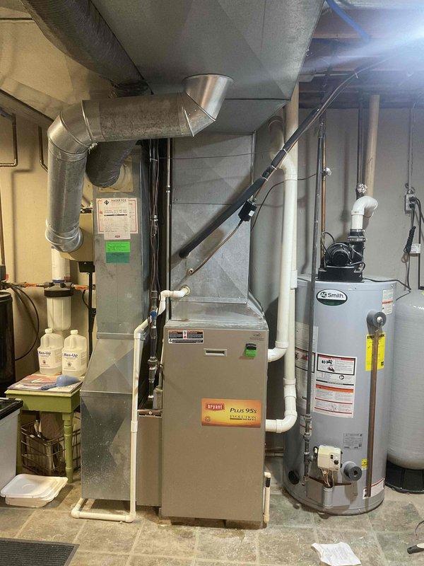 Performed inspection of existing Bryant Plus 95x furnace in no-heat situation. System is a forced air setup with standard ductwork configuration and appears to be installed in utility room alongside Smith water heater. Recommended complete furnace replacement with option for BOGO (Buy One Get One) on AC unit. Customer considering replacement options for aging system that's currently non-operational.
