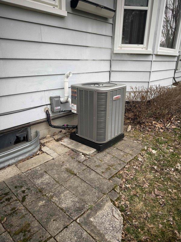 Successfully installed a complete HVAC system including a 70,000 BTU furnace and 2-ton Lennox air conditioning unit. The outdoor condenser was properly positioned on a stone paver base with appropriate electrical connections and PVC condensate drainage. All mechanical permits were secured and the system was fully reconnected with required liner installation.