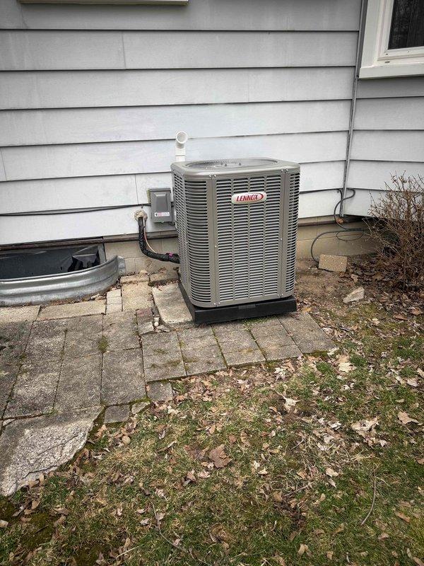 Successfully installed a complete HVAC system including a 70,000 BTU furnace and 2-ton Lennox air conditioning unit. The outdoor condenser was properly positioned on a stone paver base with appropriate electrical connections and PVC condensate drainage. All mechanical permits were secured and the system was fully reconnected with required liner installation.