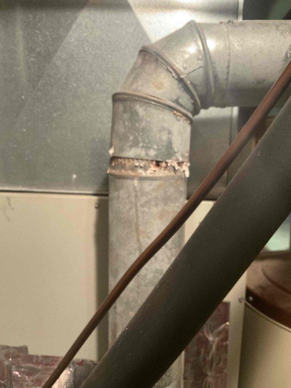Performed diagnostic assessment on a 30-year-old forced air furnace that had completely ceased operation. Inspection revealed significant deterioration of ductwork, including rusted connection points and visible corrosion along seams. Recommended complete system replacement due to age, condition, and total failure of existing unit.