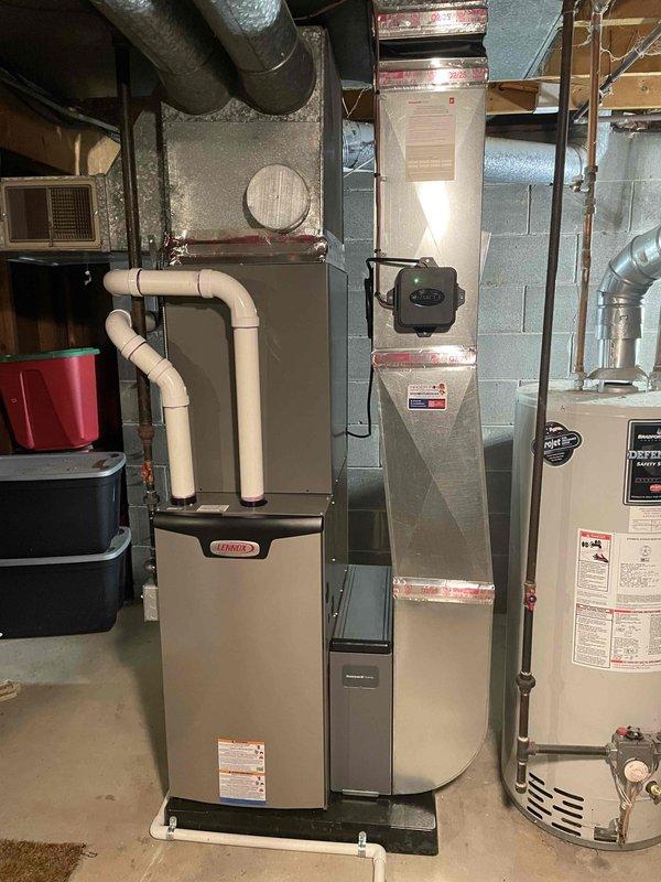 Completed installation of a complete HVAC system including a 70,000 BTU furnace and 2-ton AC unit with proper mechanical permits. System was installed on the left side of the utility room with new PVC venting, and all necessary ductwork was properly connected to the existing distribution system.