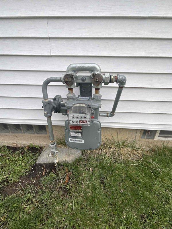 Conducted site assessment for new whole-home generator installation. Inspected existing gas meter and utility area in basement to evaluate connection possibilities. Documented current HVAC setup including water heater and furnace arrangement to determine optimal generator placement and integration requirements.