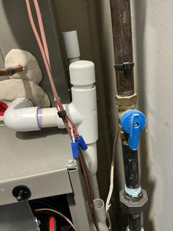 Completed annual heating maintenance on air handler unit. Installed new furnace filter and humidifier pad as scheduled. Electrical testing with multimeter confirmed system is drawing 0.46 amps, which is within normal operating parameters. All plumbing connections and water shutoff valve were inspected and found to be in proper working condition with no signs of leakage.