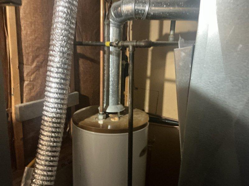 Successfully completed installation of a complete HVAC system, including a 70,000 BTU furnace and a 2-ton air conditioning unit positioned in the rear yard. All mechanical connections were properly established with appropriate permits secured for the furnace installation and AC reconnection.