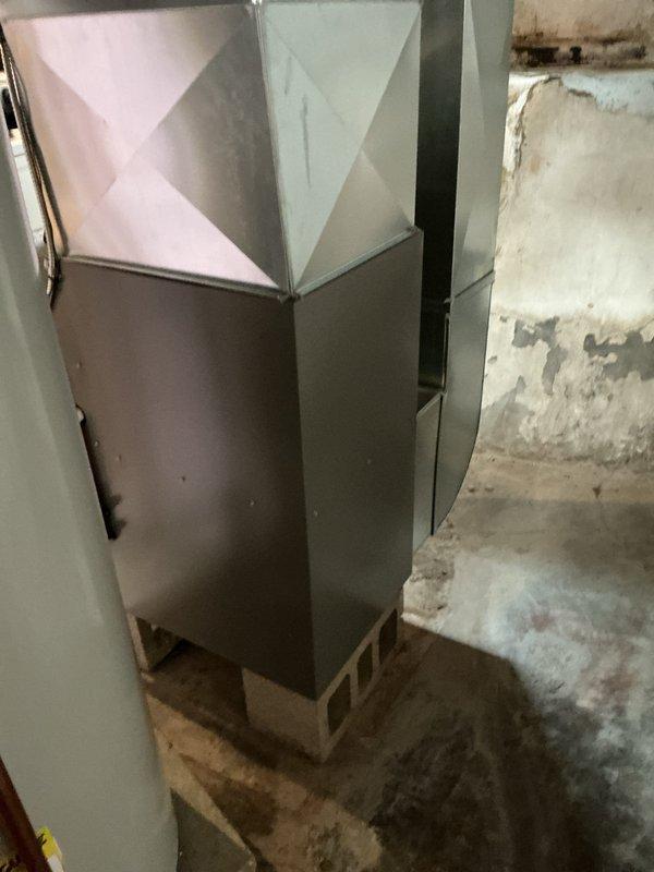 Performed annual heating maintenance on Lennox furnace system located in basement. Inspected unit for proper operation, examined ductwork connections, and evaluated surrounding environment for moisture issues. Noted aging concrete walls with signs of previous water damage that should be monitored but are not currently affecting furnace performance.