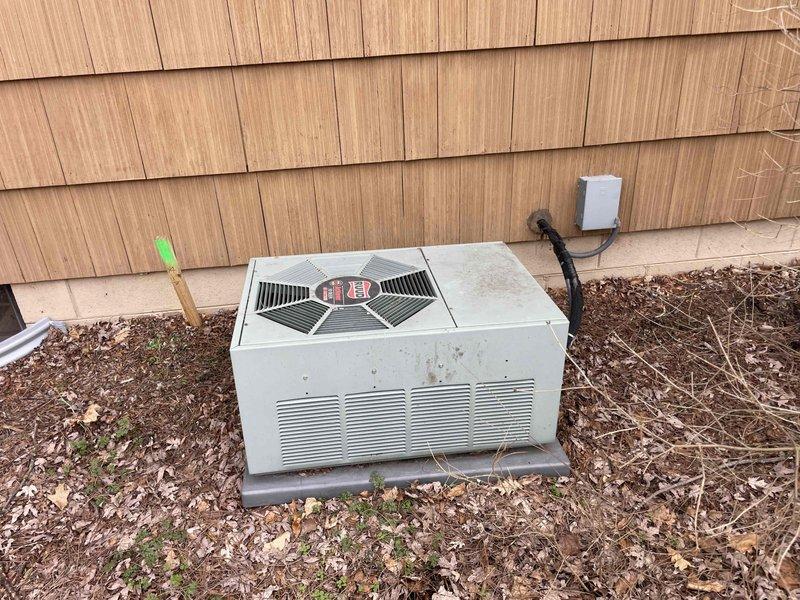 Provided quote for replacement of 30-year-old furnace and A/C system located in customer's basement. Current equipment is still operational but has reached end of useful life. Inspection revealed aging outdoor condenser unit showing signs of wear and discoloration, along with dated ductwork and connections in basement mechanical area.