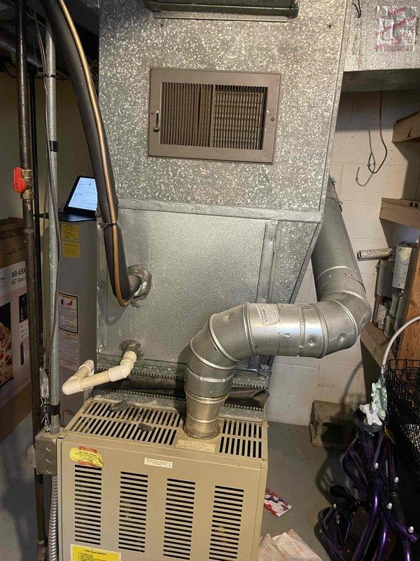 Provided quote for replacement of 30-year-old furnace and A/C system located in customer's basement. Current equipment is still operational but has reached end of useful life. Inspection revealed aging outdoor condenser unit showing signs of wear and discoloration, along with dated ductwork and connections in basement mechanical area.