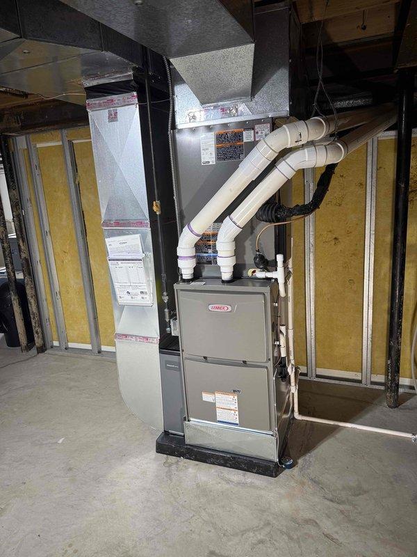 Completed installation of a complete HVAC system, including a 110,000 BTU furnace, 5-ton AC unit, and humidifier in residential location. System features Lennox equipment with proper PVC venting, new ductwork connections, and all components were successfully installed according to manufacturer specifications and local mechanical permit requirements.