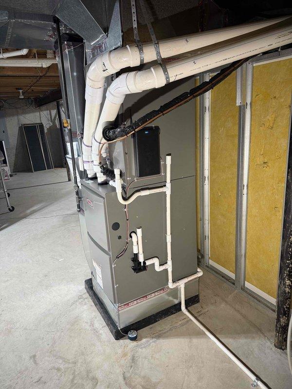 Completed installation of a complete HVAC system, including a 110,000 BTU furnace, 5-ton AC unit, and humidifier in residential location. System features Lennox equipment with proper PVC venting, new ductwork connections, and all components were successfully installed according to manufacturer specifications and local mechanical permit requirements.
