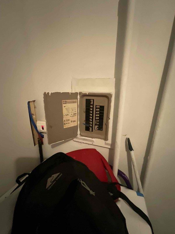 Conducted inspection of electrical service panel for CQ Quote 126488-01 A/C Only - Home Show. Documented current circuit breaker configuration and noted panel condition with visible unfinished drywall work around the installation. Photographic documentation completed for proper electrical capacity assessment prior to air conditioning system replacement.