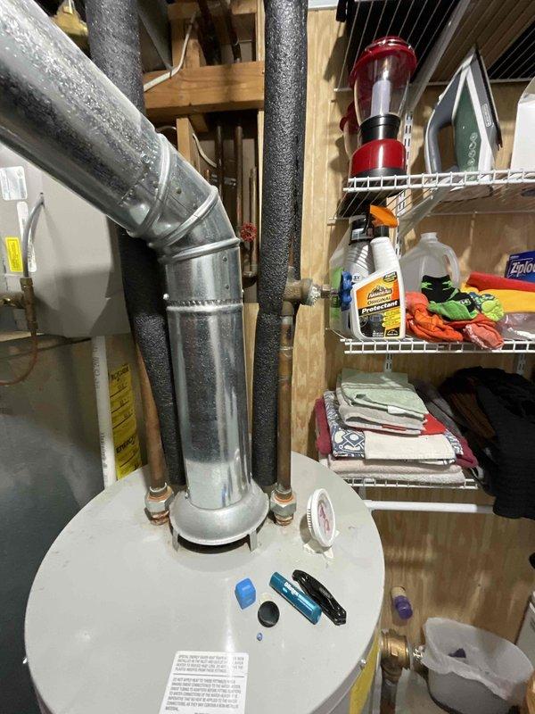 # Water Heater Replacement Estimate

Conducted on-site assessment for replacement of existing 40-gallon Bradford white water heater installed in 2010. Inspected current unit located in basement utility area, documented existing plumbing connections including hot and cold water supply lines with black foam insulation, galvanized vent ducting secured with metal straps, and verified clearances around unit. Evaluated installation space, measured available area for new equipment, and assessed condition of existing piping infrastructure. Photographed current water heater configuration, connection points, and surrounding workspace to prepare accurate replacement estimate. Confirmed customer preference for replacement of aging unit and gathered necessary specifications to provide comprehensive quote for new water heater installation including removal and disposal of existing equipment.