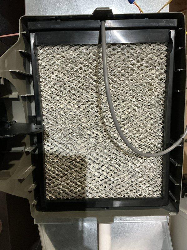 # HVAC Maintenance - AHM Service Report

Completed annual furnace tune-up and maintenance on a new 0-year-old heating system. Performed comprehensive inspection of all major components including burner assembly, heat exchanger, blower motor, and control module. Verified proper operation of blue flame burner ports and confirmed even flame distribution across burner assembly. 

Inspected and documented condition of air filter assembly, noting moderate accumulation of dust and debris on honeycomb mesh filter media. Examined refrigerant lines and condensate drainage system for proper routing and secure connections. Verified all electrical connections throughout the unit, including control board wiring harnesses, blower motor connections, and safety circuit components.

Tested furnace ignition sequence and confirmed proper operation of electronic control module and indicator lights. Inspected blower motor assembly and verified secure mounting and proper wire connections. Examined all visibl