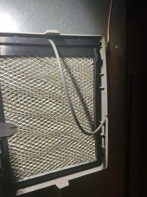 Completed annual cooling maintenance on residential HVAC system. Inspected and photographed air filter showing normal condition with pleated media intact, and exterior condenser unit with clean coil fins and operational fan assembly. All components operating within normal parameters with no deficiencies identified during this preventive maintenance visit.