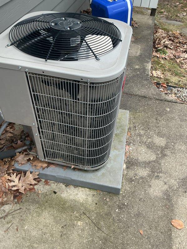 Completed annual cooling maintenance on residential HVAC system. Inspected and photographed air filter showing normal condition with pleated media intact, and exterior condenser unit with clean coil fins and operational fan assembly. All components operating within normal parameters with no deficiencies identified during this preventive maintenance visit.