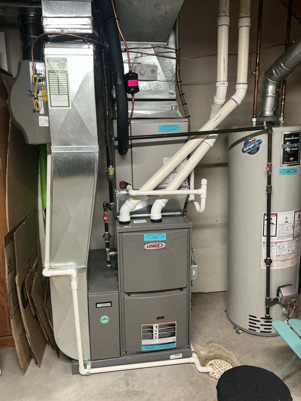 # HVAC Maintenance - ACM Service Report

Completed annual cooling maintenance on residential Lennox furnace system with integrated air handler. Performed comprehensive inspection of heat exchanger tubes and internal mechanical components through access panels. Replaced air filter and evaporator pad as noted during pre-service assessment. Verified proper operation of PVC intake and exhaust venting system. Inspected electrical connections, condensate drainage, and ductwork connections. All components found to be in functional condition with no immediate repair needs identified. System tested and returned to normal operation. Photographic documentation captured for service records.