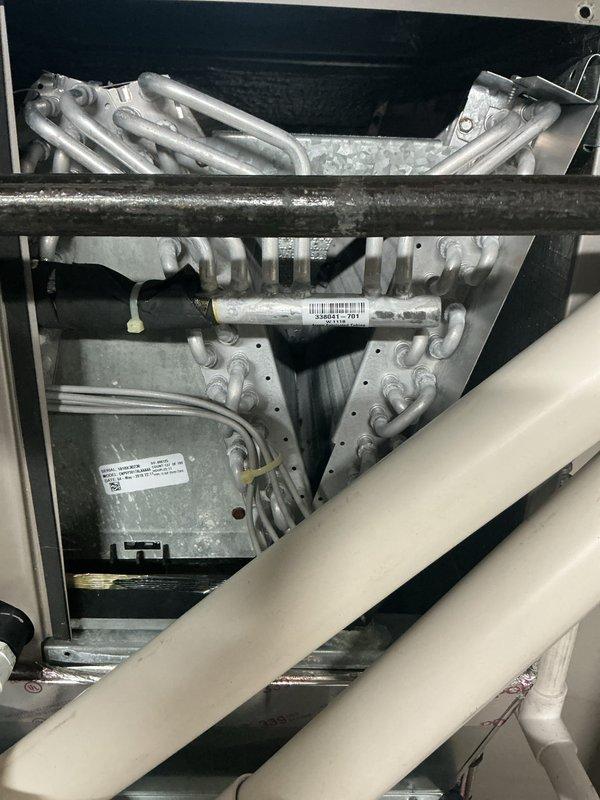 # HVAC Maintenance - ACM Service Report

Completed annual cooling maintenance on residential Lennox furnace system with integrated air handler. Performed comprehensive inspection of heat exchanger tubes and internal mechanical components through access panels. Replaced air filter and evaporator pad as noted during pre-service assessment. Verified proper operation of PVC intake and exhaust venting system. Inspected electrical connections, condensate drainage, and ductwork connections. All components found to be in functional condition with no immediate repair needs identified. System tested and returned to normal operation. Photographic documentation captured for service records.