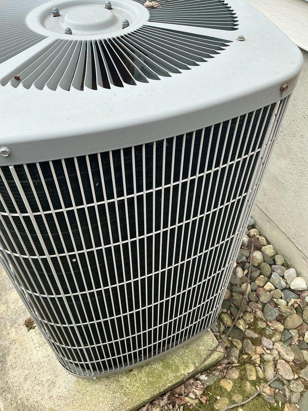Completed annual cooling maintenance on residential HVAC system. Inspected outdoor condenser unit, verified fan operation and structural integrity, and examined internal control board and electrical connections. All components found to be in proper working order with no immediate service needs identified.