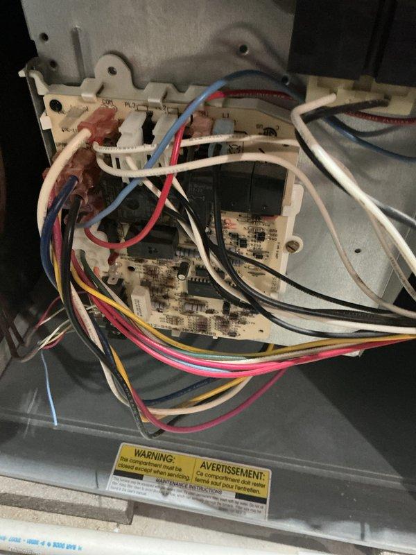 Completed annual cooling maintenance on residential HVAC system. Inspected outdoor condenser unit, verified fan operation and structural integrity, and examined internal control board and electrical connections. All components found to be in proper working order with no immediate service needs identified.