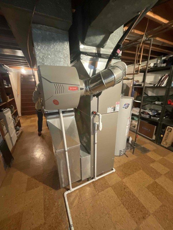 Responded to no heat call for forced air furnace system of unknown age. Upon inspection, assessed existing furnace and HVAC equipment configuration in basement mechanical room. Evaluated system condition and determined replacement was more cost-effective option than repair. Provided comprehensive estimate for complete furnace replacement, documenting existing equipment specifications, ductwork connections, and installation requirements. Photographed current system setup including furnace cabinet, humidifier unit, ductwork configuration, and internal components to support replacement quote and ensure proper equipment sizing for new installation.