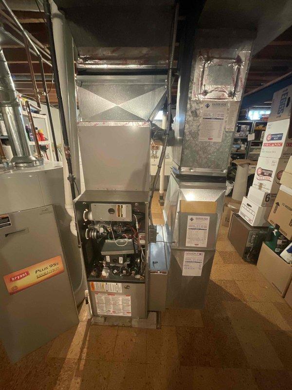 Responded to no heat call for forced air furnace system of unknown age. Upon inspection, assessed existing furnace and HVAC equipment configuration in basement mechanical room. Evaluated system condition and determined replacement was more cost-effective option than repair. Provided comprehensive estimate for complete furnace replacement, documenting existing equipment specifications, ductwork connections, and installation requirements. Photographed current system setup including furnace cabinet, humidifier unit, ductwork configuration, and internal components to support replacement quote and ensure proper equipment sizing for new installation.