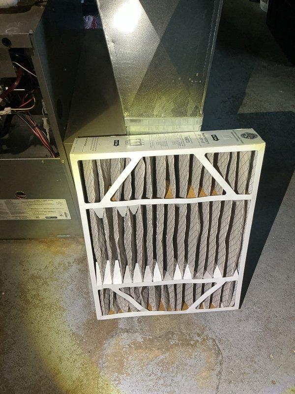 # HVAC Maintenance - Annual Heating Maintenance

Completed annual heating maintenance service on residential forced air furnace system. Performed comprehensive inspection of gas furnace unit including all internal components, electrical connections, and safety controls.

Removed and replaced heavily soiled pleated air filter which showed significant dust and debris accumulation. Old filter displayed darkened, discolored pleats indicating restricted airflow and reduced system efficiency. Installed new filter with proper specifications to restore optimal air circulation and indoor air quality.

Conducted thorough visual inspection of furnace interior components including blower motor assembly, gas valve, heat exchanger, control board, and all electrical wiring connections. Verified proper operation of ignition system and flame sensor. Inspected condition of burner assembly and combustion chamber. Checked all wire connections to control board and safety switches for secure attachment and 