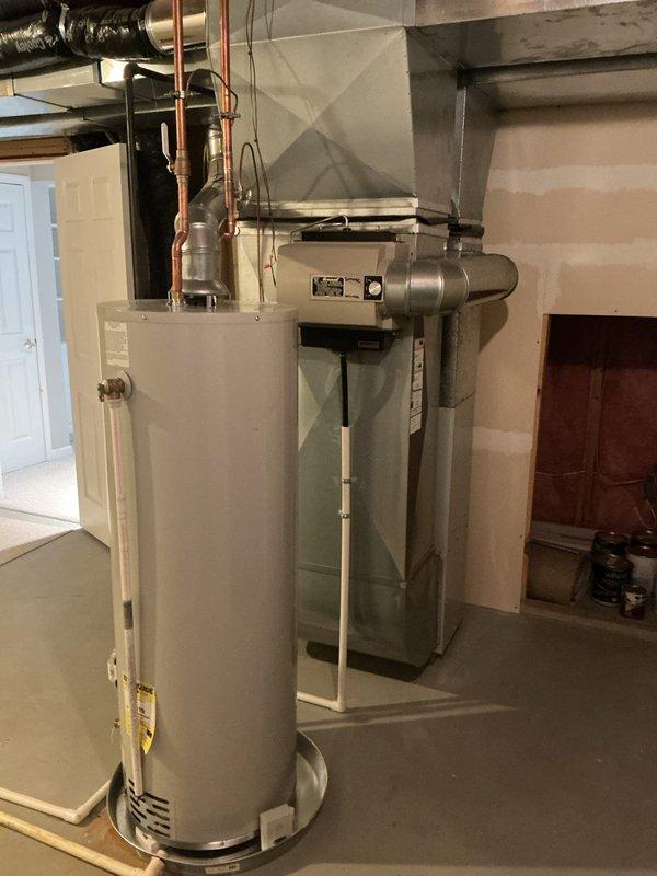 Completed annual HVAC maintenance on Carrier furnace system and inspected associated mechanical equipment in basement utility area. Performed routine system diagnostics, verified proper operation of heating components, checked ductwork connections, and documented equipment condition through photographic records.