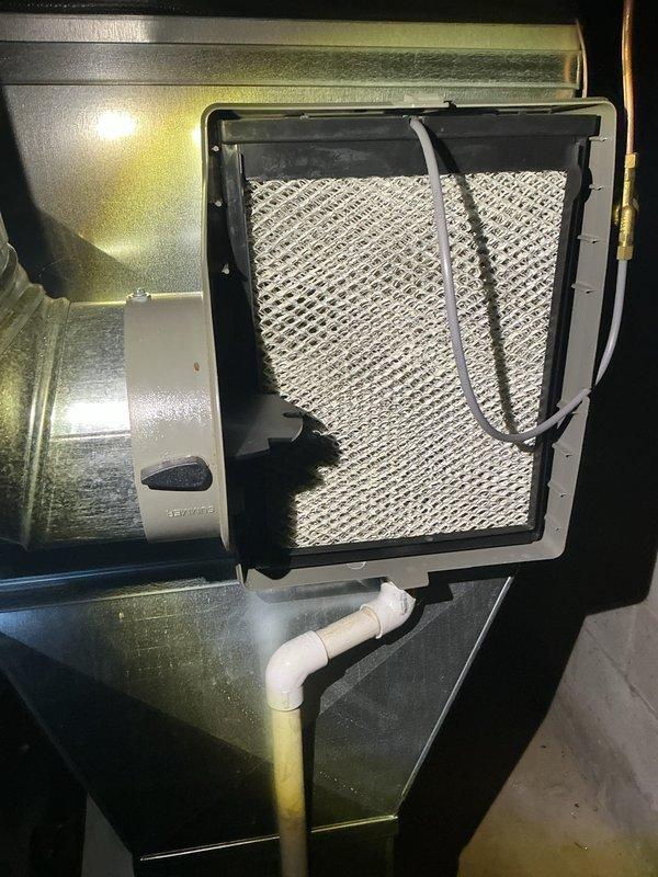 Completed comprehensive ComfortGuard maintenance visit on residential HVAC system, including thorough inspection of air handler unit, ductwork connections, and drainage systems. Replaced humidifier pad as requested during pre-service call, verified proper operation of all electrical connections, condensate drain trap functionality, and filter condition. All system components found to be operating within normal parameters with no additional repairs required at this time.