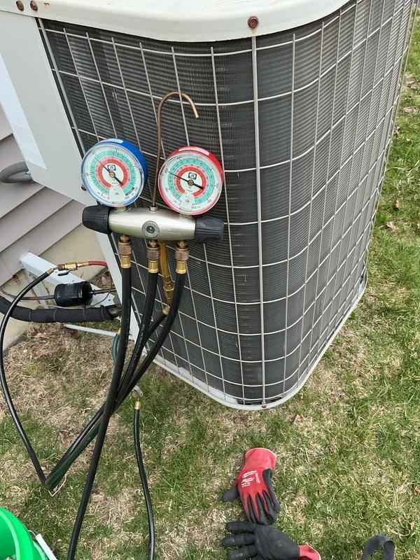 Completed annual preventative maintenance on outdoor air conditioning condenser unit. Connected manifold gauge set to service ports and verified refrigerant pressures and system operating parameters within manufacturer specifications. Unit inspected, tested, and confirmed operational with no deficiencies noted.