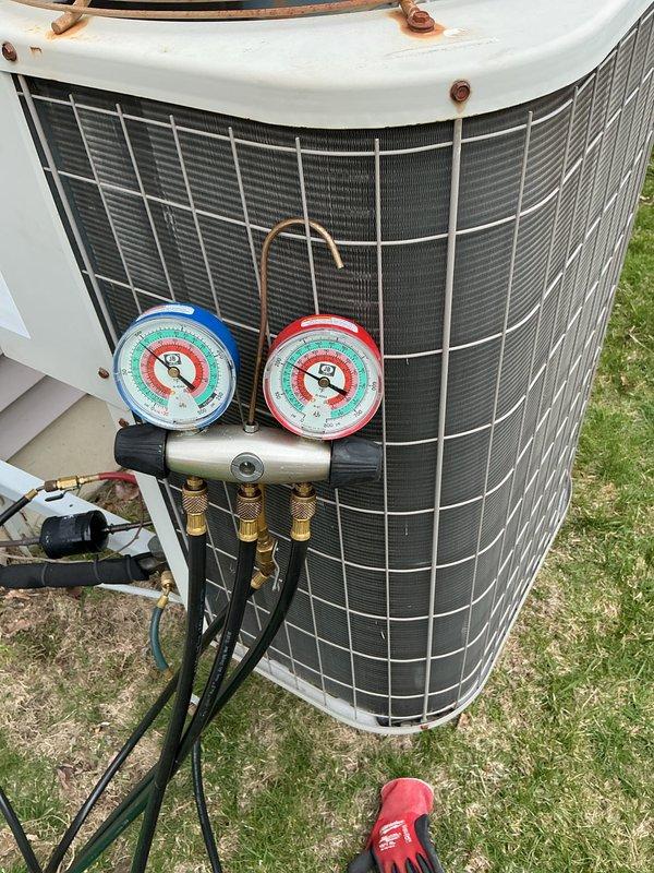 Completed annual preventative maintenance on outdoor air conditioning condenser unit. Connected manifold gauge set to service ports and verified refrigerant pressures and system operating parameters within manufacturer specifications. Unit inspected, tested, and confirmed operational with no deficiencies noted.