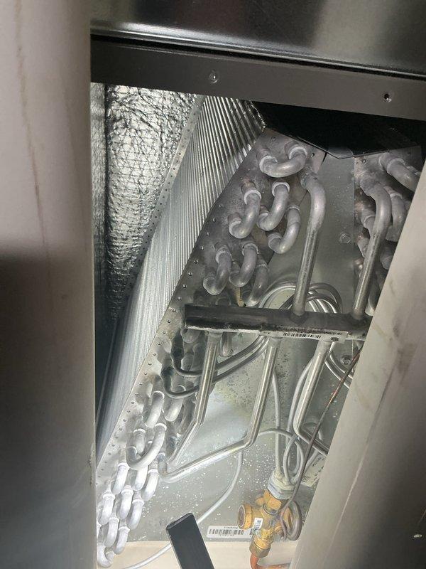 Completed comprehensive ComfortGuard maintenance package including inspection of evaporator coil assembly and refrigerant line system. Addressed hot spot issues on condensate drain pad, inspected exterior refrigerant line insulation for proper coverage, and verified all HVAC components operating within normal parameters. All systems tested and confirmed functioning correctly upon completion.