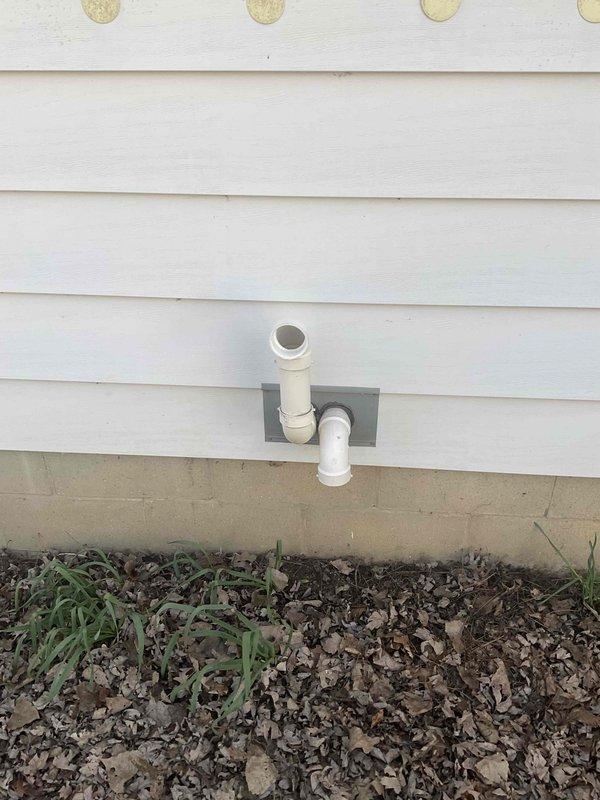 Completed comprehensive estimate for replacement of 14-year-old furnace system located in basement utility room. Inspection included evaluation of existing heating unit, humidifier, thermostat, and hot water tank to determine replacement specifications and system compatibility. Documented current equipment configuration including ductwork connections, venting assembly through exterior wall via PVC piping, and overall mechanical room layout to prepare accurate replacement proposal for residential heating system.