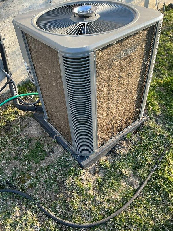 Completed comprehensive AHC maintenance on heating and cooling systems. Inspected outdoor condensing unit, which showed significant accumulation of dirt, dust, and debris on exterior surfaces and louvers requiring attention. Replaced air filters and evaporative cooler pads as needed to maintain optimal system performance and airflow efficiency.