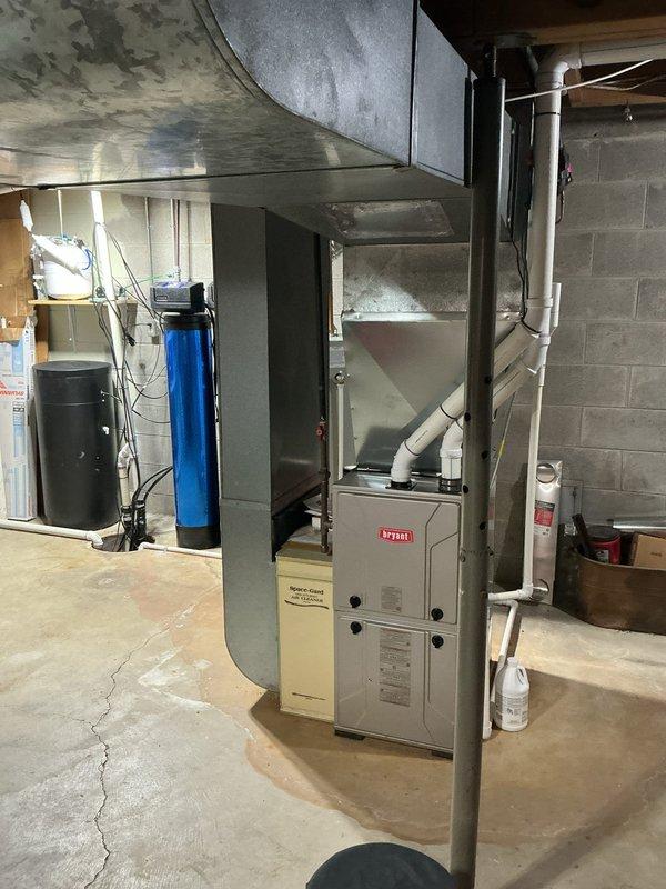 Performed comprehensive annual maintenance on residential central air conditioning system and Bryant furnace. Inspected and verified proper operation of Air Scrubber air purification unit mounted to supply ductwork in attic space. Conducted complete system evaluation including refrigerant levels, electrical connections, condensate drainage, and airflow measurements. Cleaned condenser coils, checked thermostat calibration, and verified all safety controls functioning properly. System operating within manufacturer specifications with no immediate repairs required at this time.