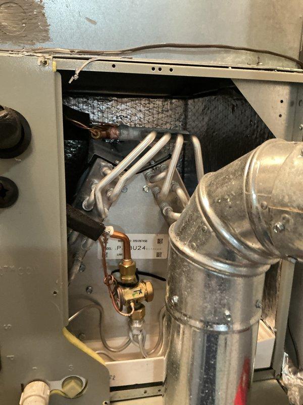 Completed annual cooling maintenance on residential HVAC system. Performed comprehensive inspection of outdoor condenser unit and indoor air handler components, including examination of refrigerant lines, dual-run capacitor, compressor motor, and filtration system. All components found to be operational with normal wear patterns, copper lines showing typical patina, and capacitor functioning within specifications. System tested and verified for proper operation with no deficiencies noted.