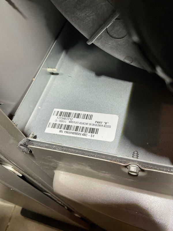 Completed annual cooling maintenance service on HVAC system. Inspected air handler unit and blower access components, verified proper operation of all mechanical equipment. Documented system identification labels and part numbers for service records. Evaluated filter and evaporator pad condition as part of routine preventative maintenance protocol. All components found in satisfactory working order with no immediate service needs identified.