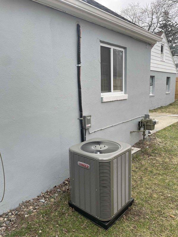 Completed installation of 2-ton air conditioning system with matching evaporator coil at rear of residence. Installed new outdoor condenser unit on protective pad with proper clearances, ran new electrical circuit with disconnect box and conduit mounted to exterior wall, and secured all necessary mechanical and electrical permits prior to installation. System tested and operational upon completion.