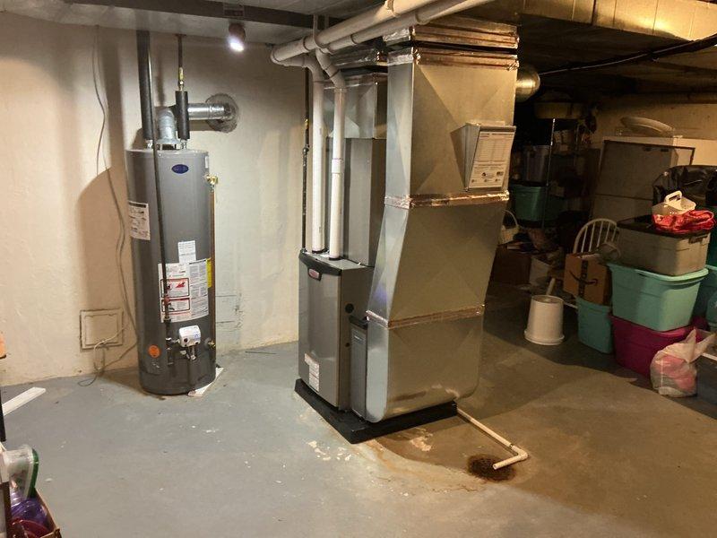 Completed full HVAC system installation in basement mechanical room, including new furnace and air conditioning unit. Installed all necessary ductwork connections, refrigerant lines, condensate drainage, and electrical connections per manufacturer specifications. System was tested for proper operation, permits were obtained, and all required documentation including energy rebate paperwork and financing forms were processed and submitted.