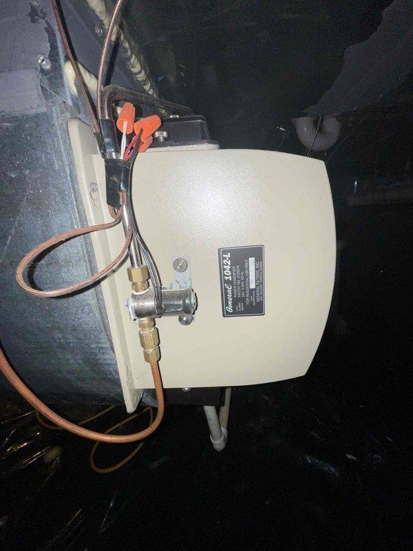 Completed estimate for replacement of 27-year-old residential furnace system. Inspected existing heating unit and humidifier accessory in basement, documented current equipment condition including copper tubing connections, electrical wiring, and exterior venting configuration through foundation wall. Provided quote for new furnace installation to be scheduled within the next month per homeowner's request.