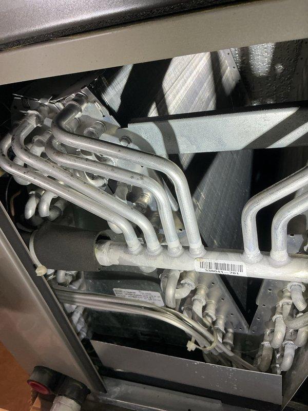 Completed annual cooling maintenance on Bryant condensing unit. Inspected evaporator coils, condenser coils, and refrigerant lines for proper operation and wear. All components found in good working condition with normal operational wear patterns. Unit operating within manufacturer specifications with no deficiencies noted.