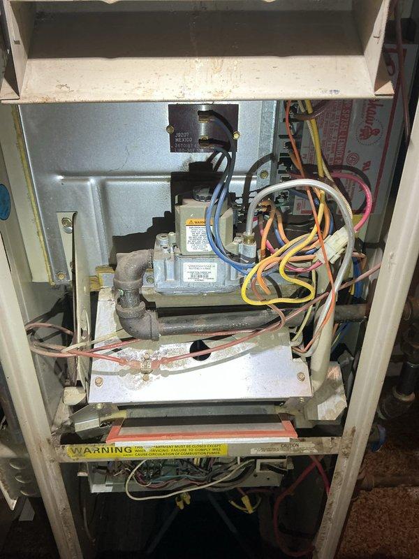 Responded to no heat call on 10+ year old furnace located in main floor utility room. Upon arrival, confirmed unit was not heating or turning on. Performed diagnostic evaluation of gas furnace system, inspecting control board, gas valve assembly, blower motor, and electrical connections. Identified failed ignition system preventing unit from initiating heating cycle. Replaced faulty ignitor and tested all safety controls including flame sensor and limit switches. Verified proper gas pressure at valve, confirmed all wire connections secure, and cleaned accumulated dust from blower compartment and burner assembly. Cycled unit through multiple heating cycles to ensure reliable ignition and proper operation. System now heating normally with all safety controls functioning as designed.