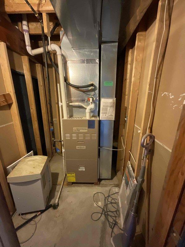 Conducted comprehensive assessment of existing 16-year-old residential air conditioning system original to 2002 construction, evaluating indoor furnace unit in basement and outdoor condensing unit for replacement estimate. Customer reported system has historically underperformed and is seeking replacement within current season. Documented equipment condition, configuration, and installation parameters including ductwork connections, electrical service, refrigerant lines, and condensate drainage for complete system replacement proposal.