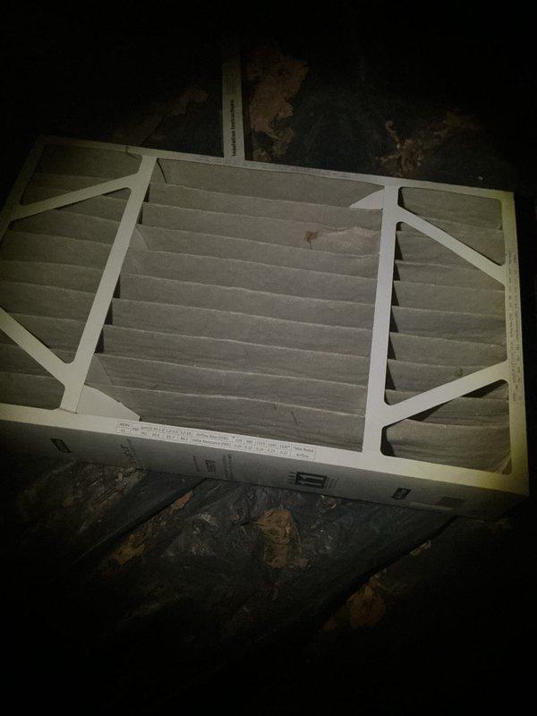 Completed routine air handler maintenance inspection and filter replacement. Accessed air handler unit in basement utility area, removed and replaced dirty pleated air filter showing visible dust and debris accumulation. Verified proper filter installation in frame, inspected blower motor housing, electrical connections, and associated ductwork for proper operation. System operational upon completion.